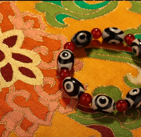 Three-Eyed Dzi Bead Red Agate Bracelet