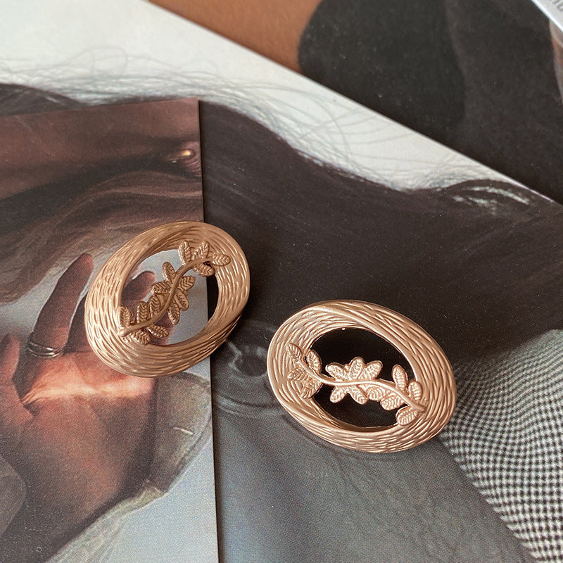 Hollow Leaf Shell Metal Button Trench Coat