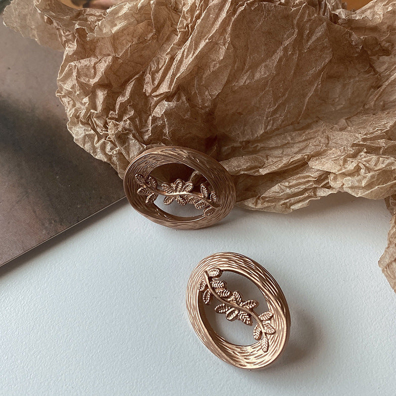 Hollow Leaf Shell Metal Button Trench Coat