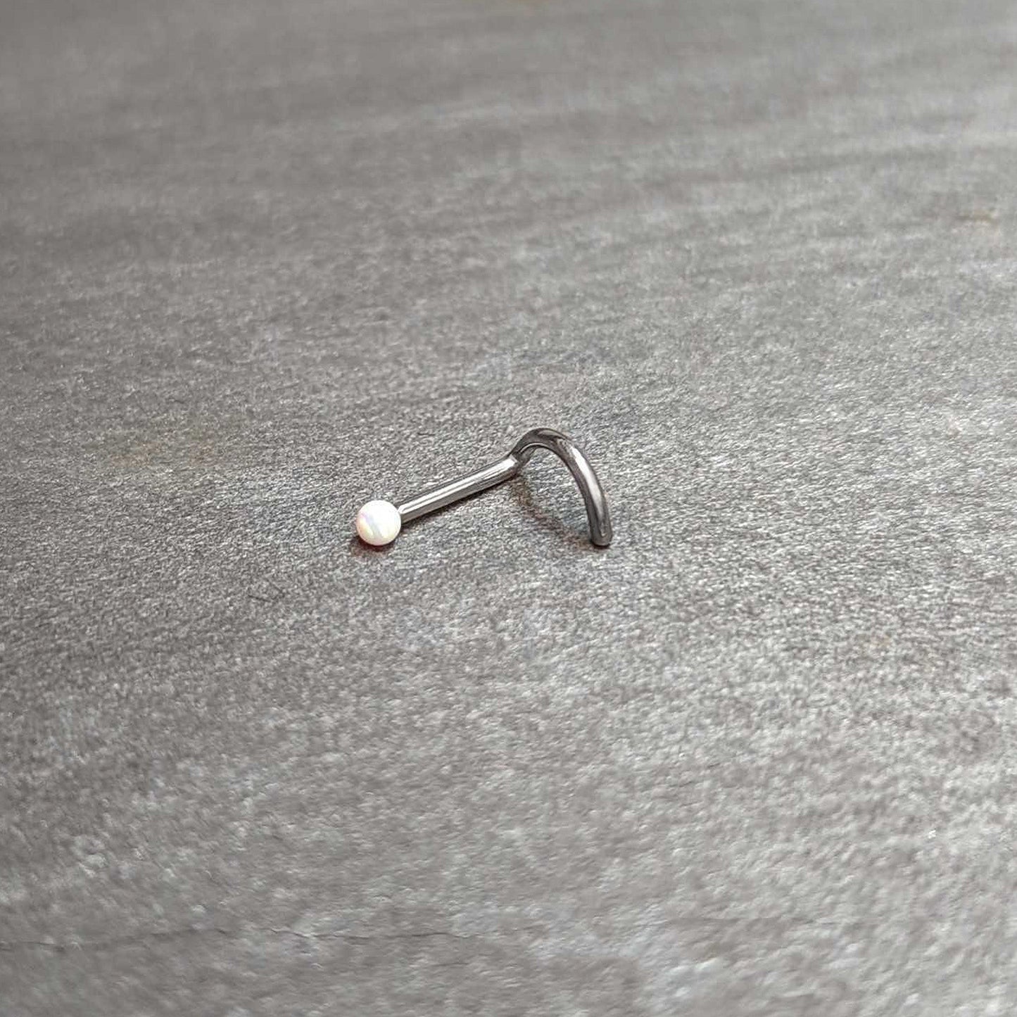 18G 1/4 White Synth Opal G23 Titanium Threadless Left Nose Screw