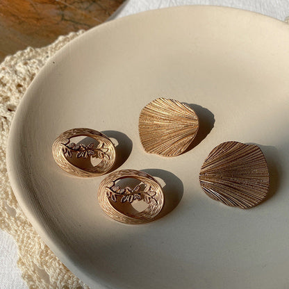 Hollow Leaf Shell Metal Button Trench Coat