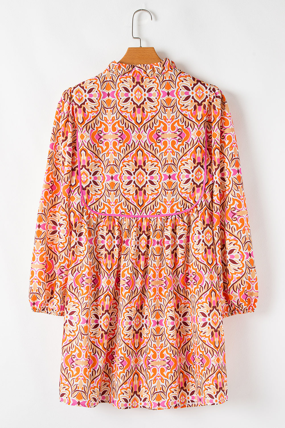 Abstract Long Sleeve Tied Neckline Mini Dress