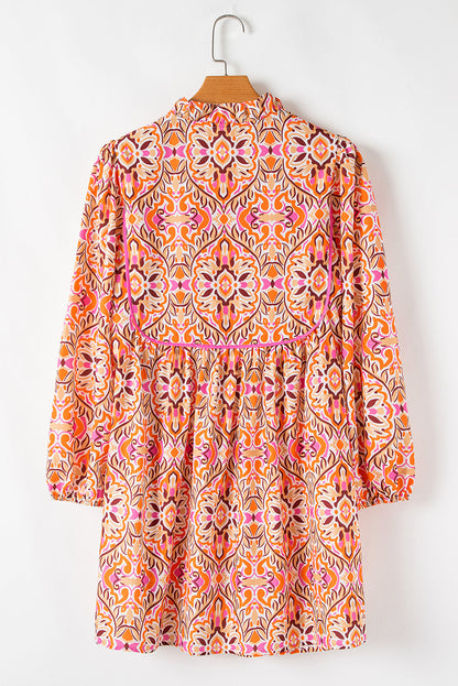 Abstract Long Sleeve Tied Neckline Mini Dress
